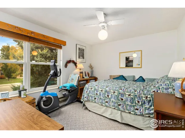 a bedroom with bed and glass door