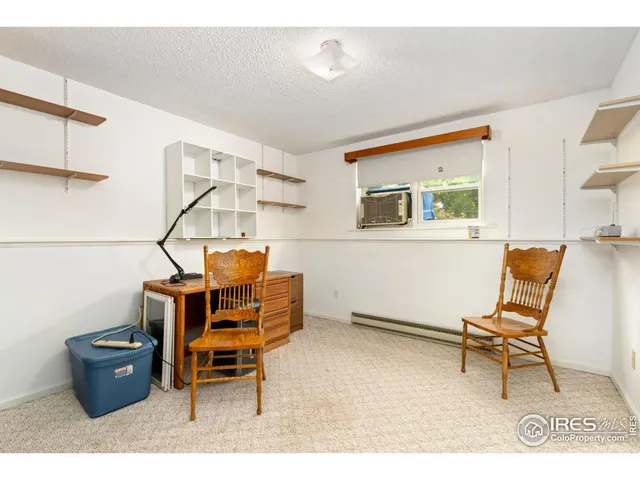 a living room with furniture and a piano