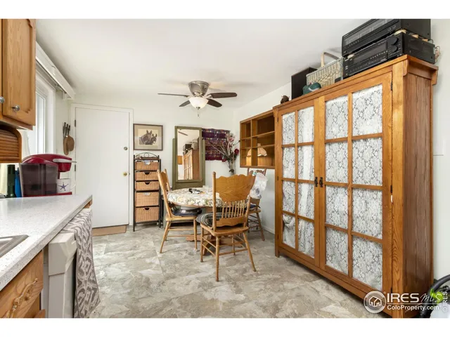 a view of a livingroom with furniture and a window