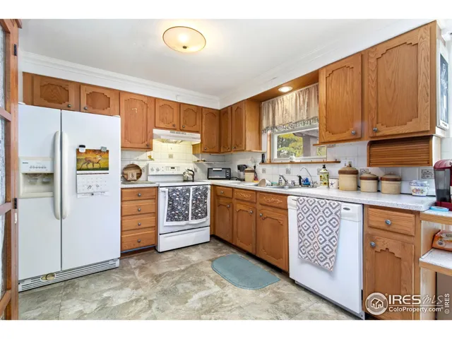 a kitchen with window cabinets and a sink