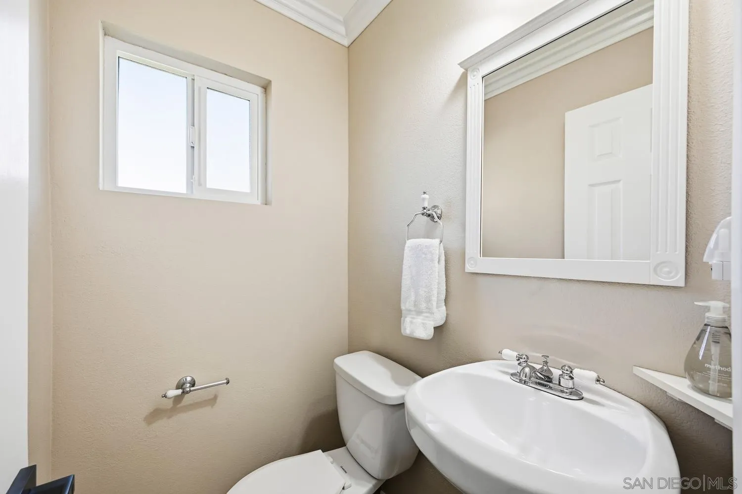 944 Hillhaven Road Escondido, CA 92027 - Photo 16 of 31 a bathroom with a sink a toilet and mirror