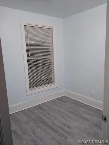 a bathroom with a toilet and a bath tub
