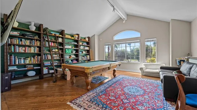 a bathroom with a double vanity sink toilet and shower