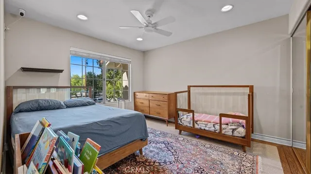 a bed sitting in a bedroom next to a window