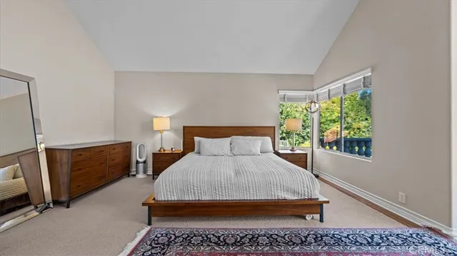 a bedroom with a bed and a fireplace