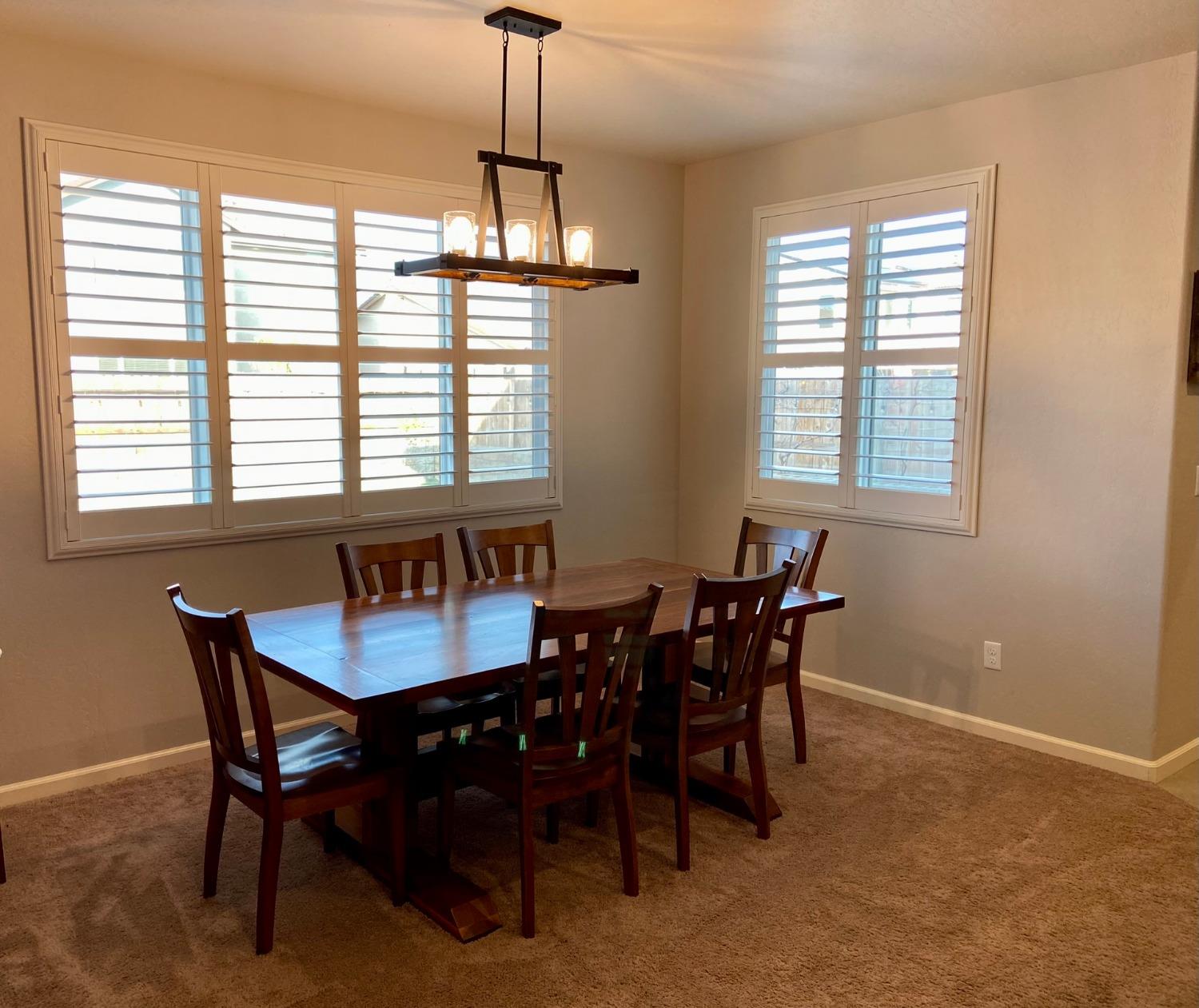 3967 Lincoln Avenue Clovis, CA 93611 - Photo 16 of 70 a view of a dining room with a table and chairs