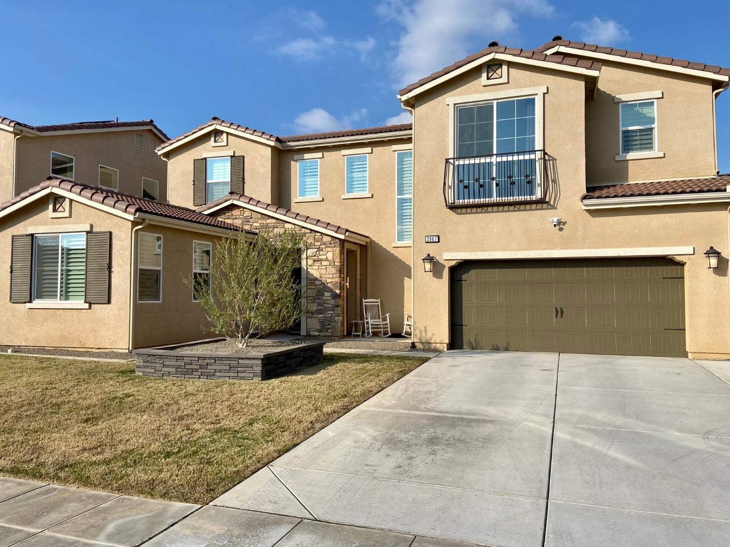 3967 Lincoln Avenue Clovis, CA 93611 - Photo 2 of 70 a front view of a house with a yard