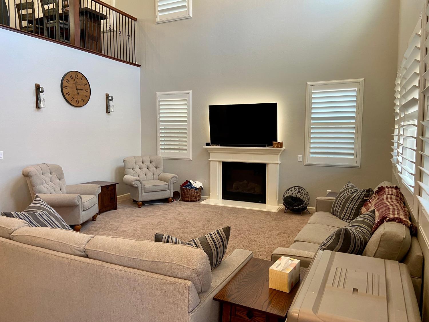 3967 Lincoln Avenue Clovis, CA 93611 - Photo 22 of 70 a living room with furniture and a fireplace