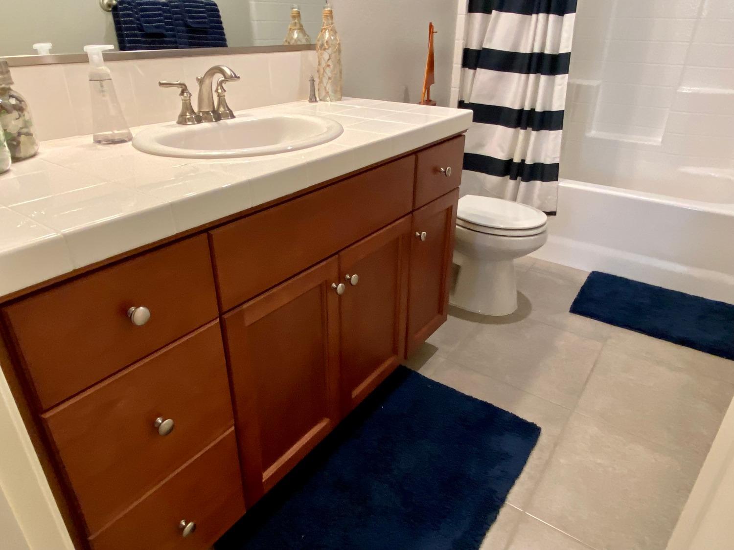 3967 Lincoln Avenue Clovis, CA 93611 - Photo 61 of 70 a bathroom with a sink and a toilet