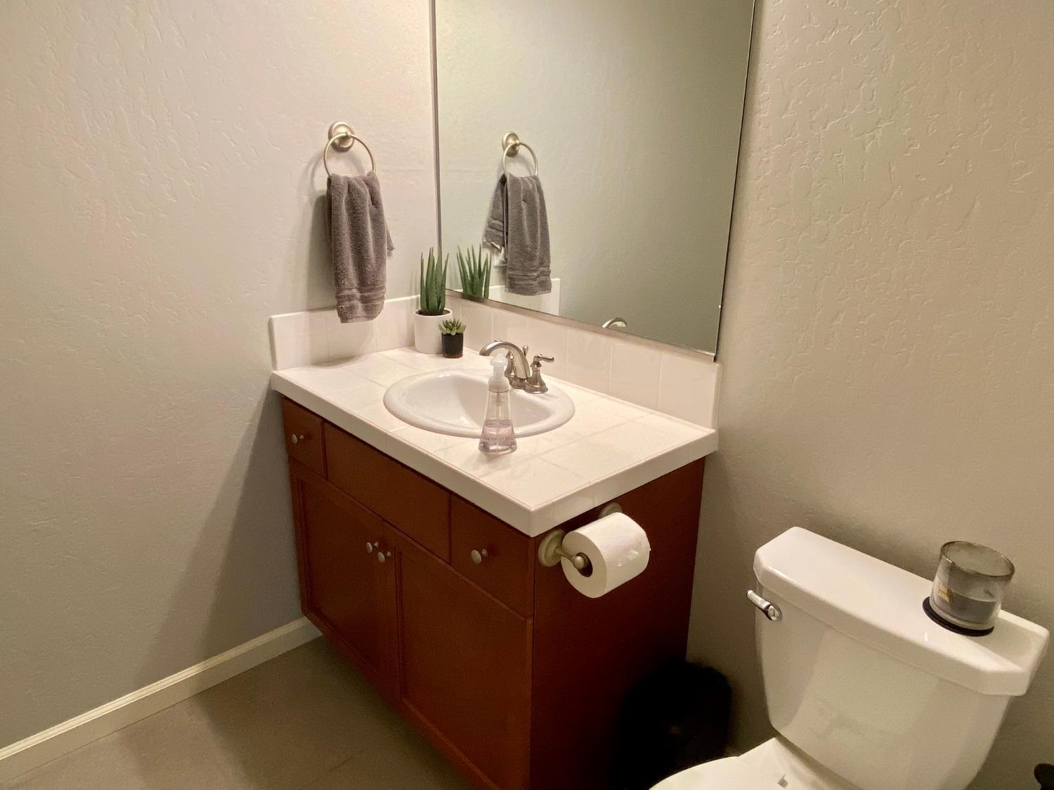 3967 Lincoln Avenue Clovis, CA 93611 - Photo 63 of 70 a bathroom with a sink and a toilet
