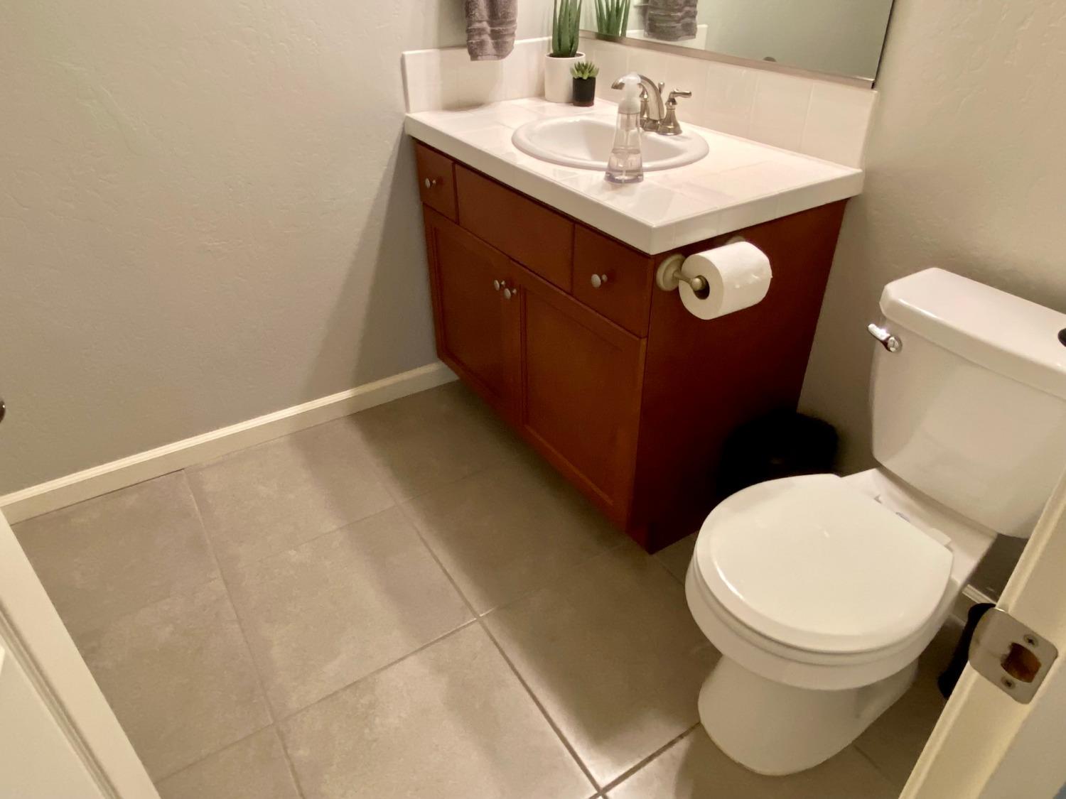 3967 Lincoln Avenue Clovis, CA 93611 - Photo 64 of 70 a bathroom with a sink mirror vanity and toilet