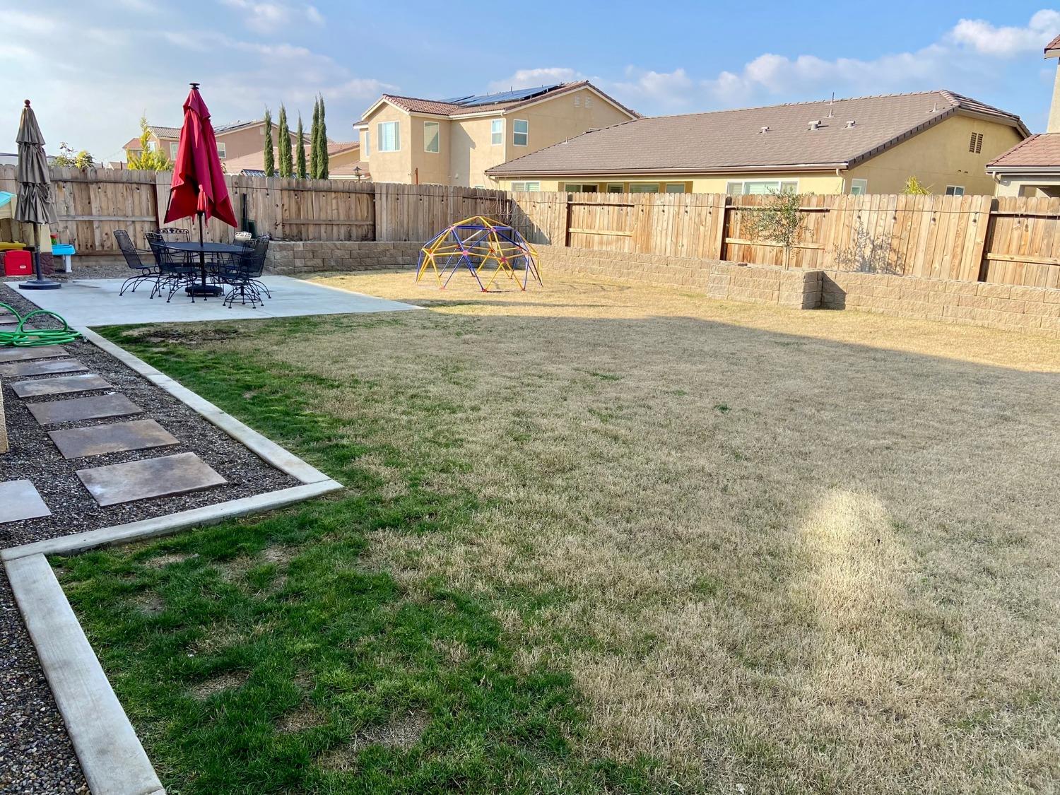 3967 Lincoln Avenue Clovis, CA 93611 - Photo 65 of 70 a view of a house with backyard and a yard