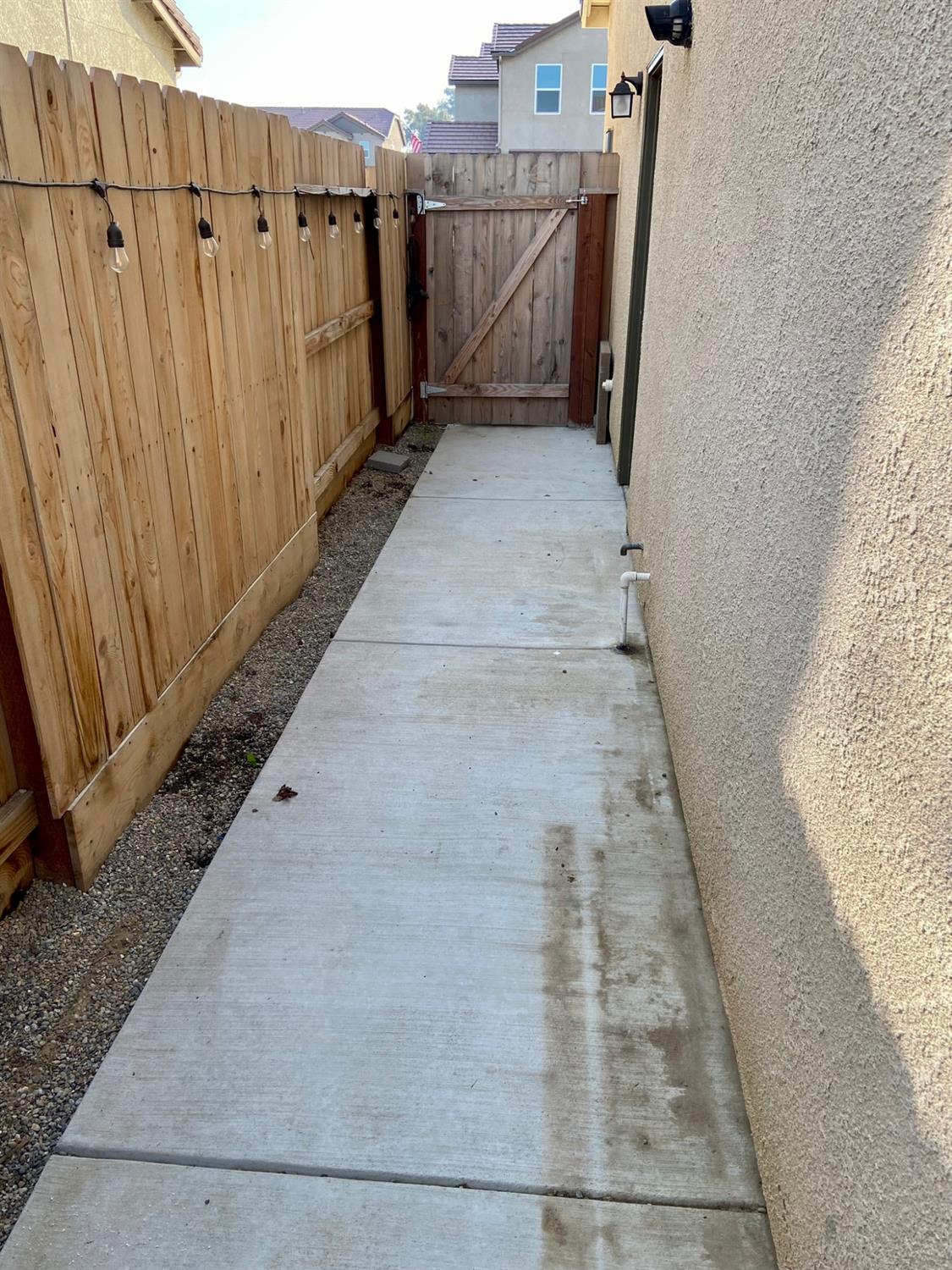 3967 Lincoln Avenue Clovis, CA 93611 - Photo 69 of 70 a view of a pathway gate with wooden fence