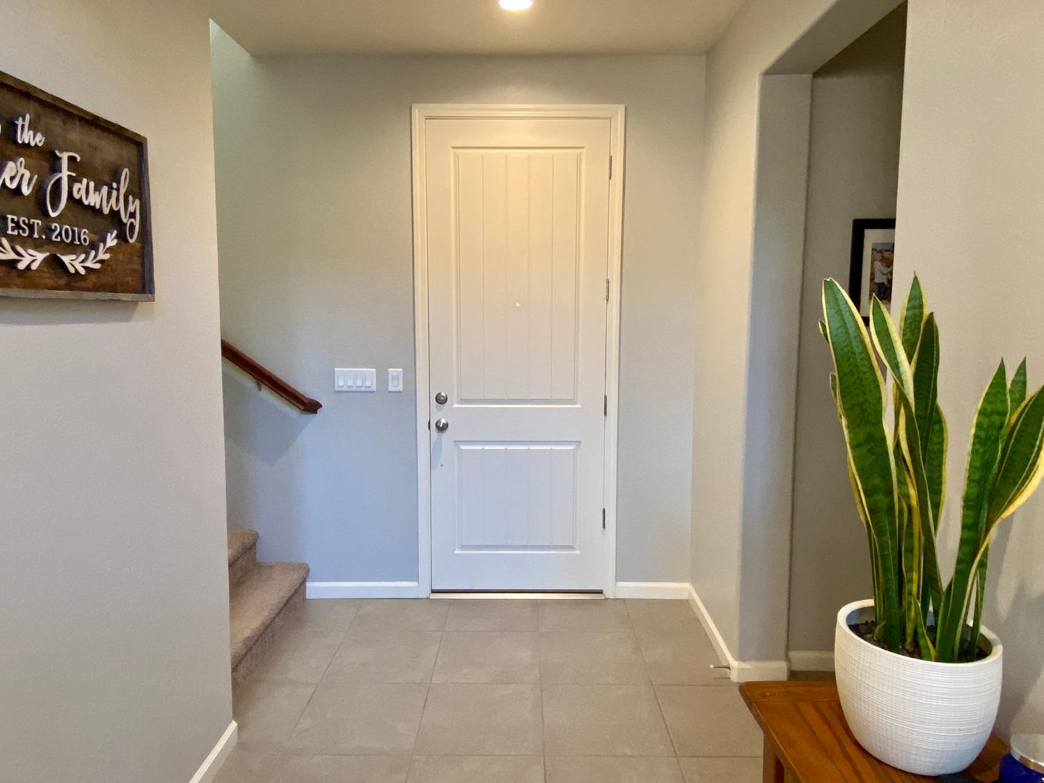 3967 Lincoln Avenue Clovis, CA 93611 - Photo 7 of 70 a view of a potted plant in a bathroom next to a window