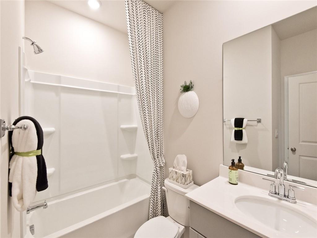 93 Proust Circle Dallas, GA 30132 - Photo 7 of 18 a bathroom with a sink vanity mirror and toilet