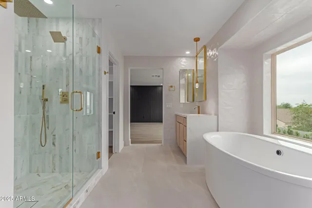 a bathroom with a bathtub shower and toilet