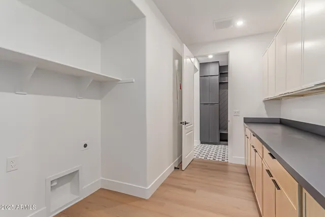 a view of a kitchen with a sink and refrigerator