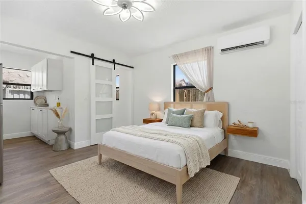 a bedroom with a bed furniture and a window
