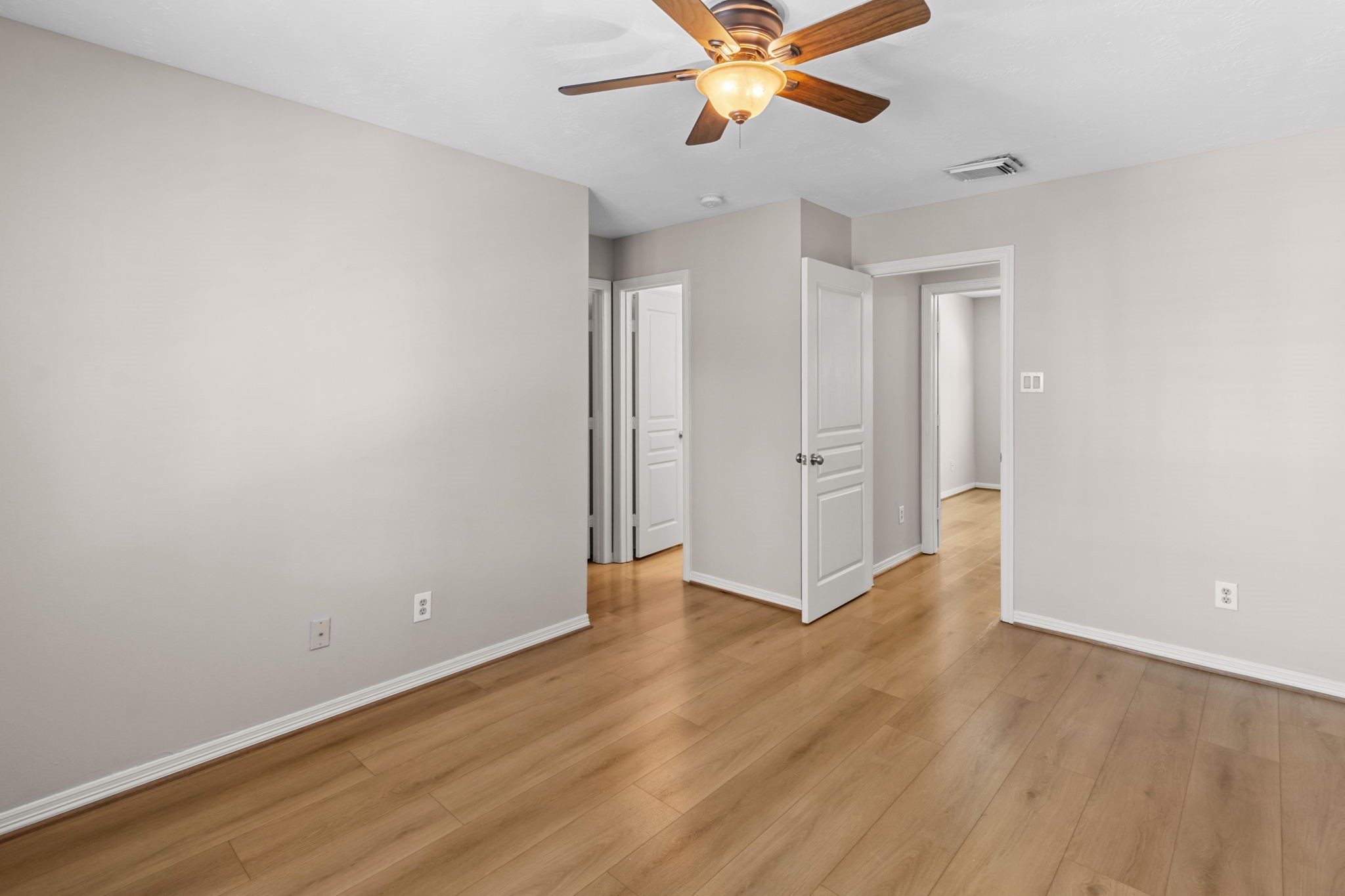 3506 Garrow Street Houston, TX 77003 - Photo 28 of 32 an empty room with wooden floor closet and windows