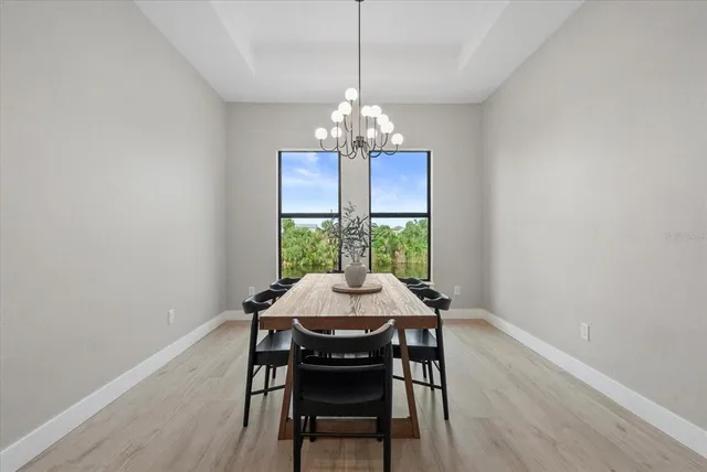 a large kitchen with a table and chairs