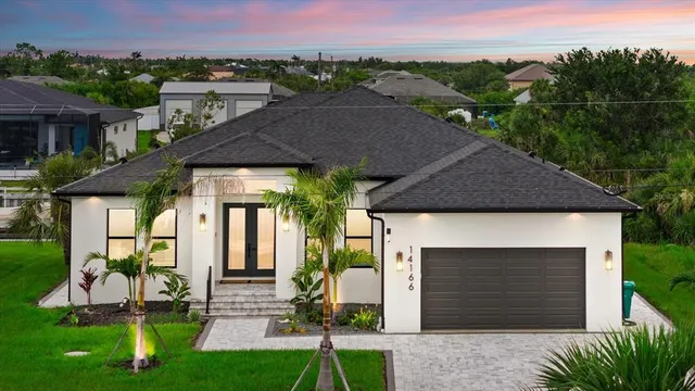 a front view of a house with a yard