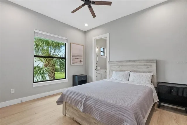 a bedroom with two beds and a window