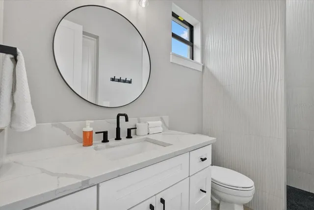 a kitchen with a stove and cabinets