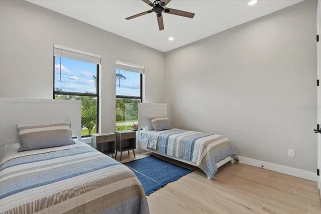 a kitchen with white cabinets and sink
