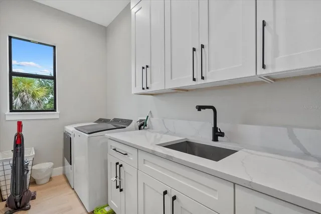 a bathroom with a double vanity sink mirror and shower