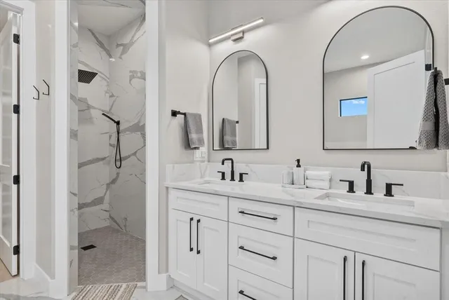 a front view of a house with a garden and plants