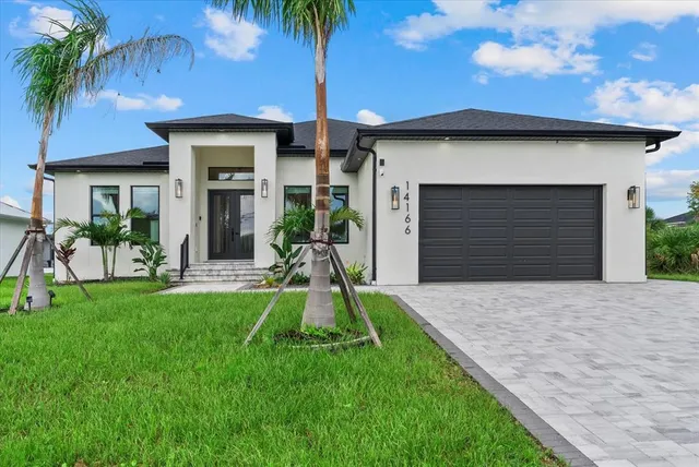 a swimming pool with outdoor seating and garden