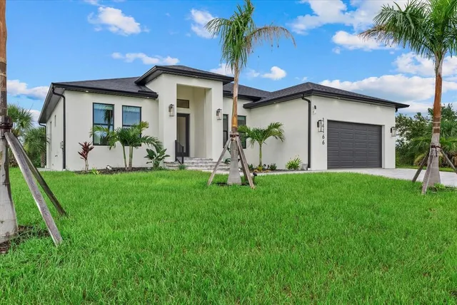 a front view of house with yard and green space