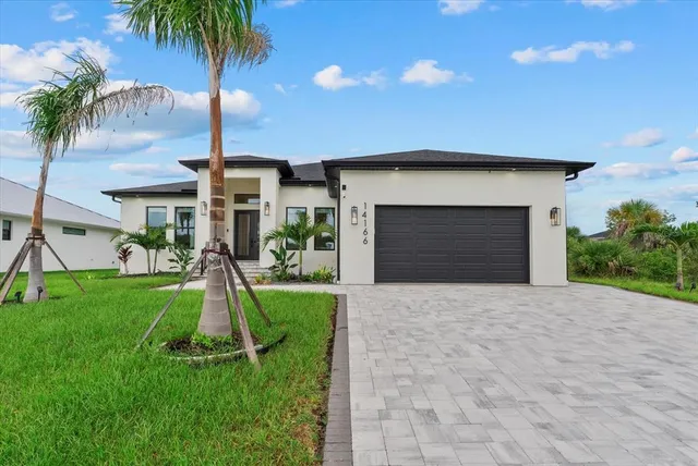 a house with garden in front of it