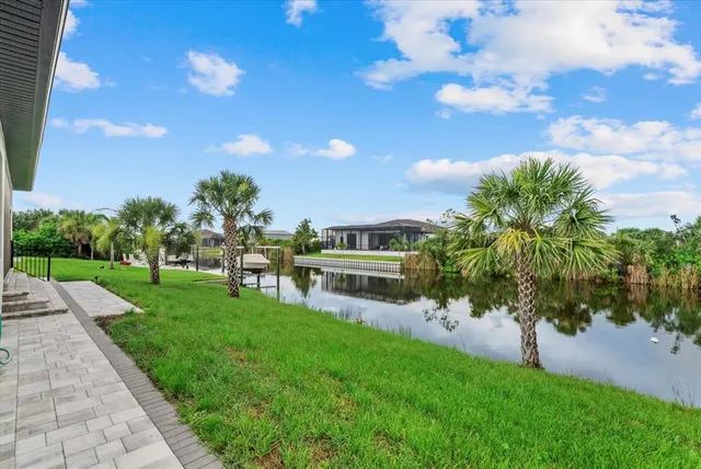 a view of a yard with a house in the background