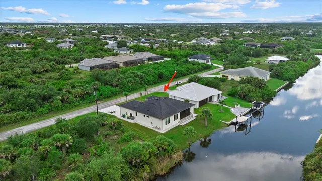 an aerial view of a house with a garden