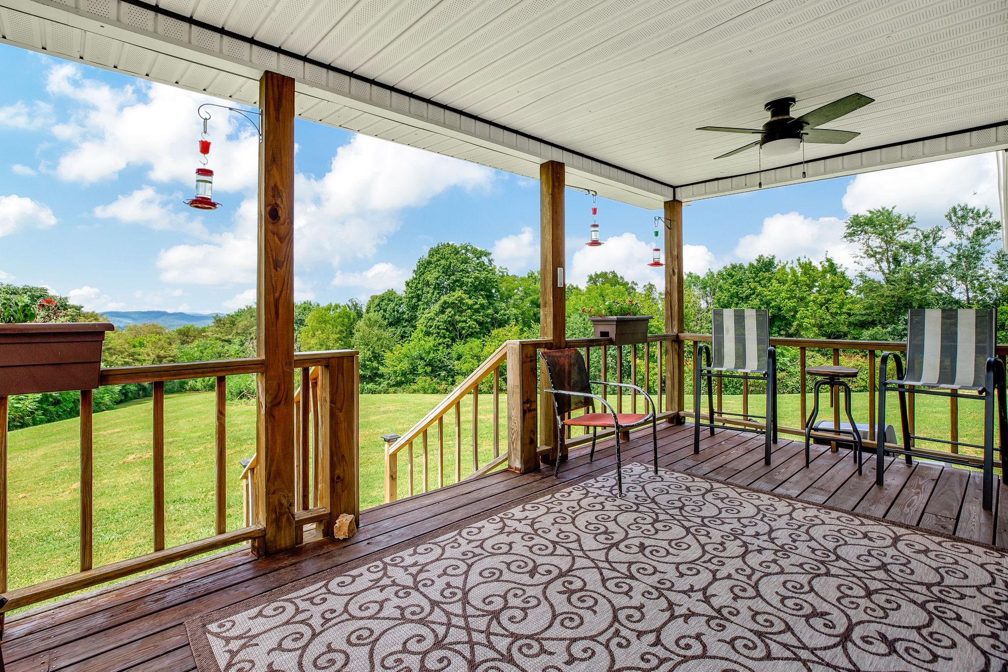 5461 Dale Ridge Road Liberty, TN 37095 - Photo 22 of 39 a view of a porch with chairs and backyard