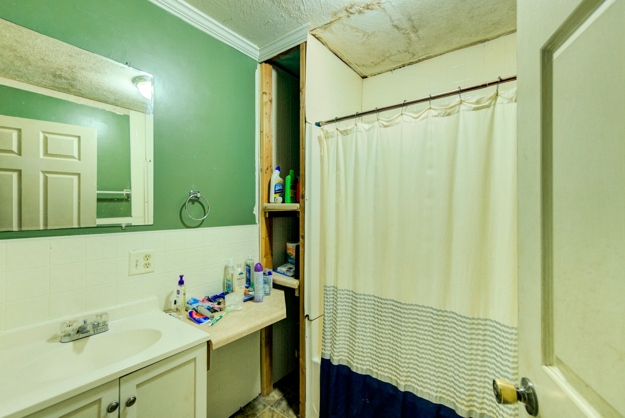 4066 Beech Bluff Road Beech Bluff, TN 38313 - Photo 12 of 14 a bathroom with a sink and a mirror