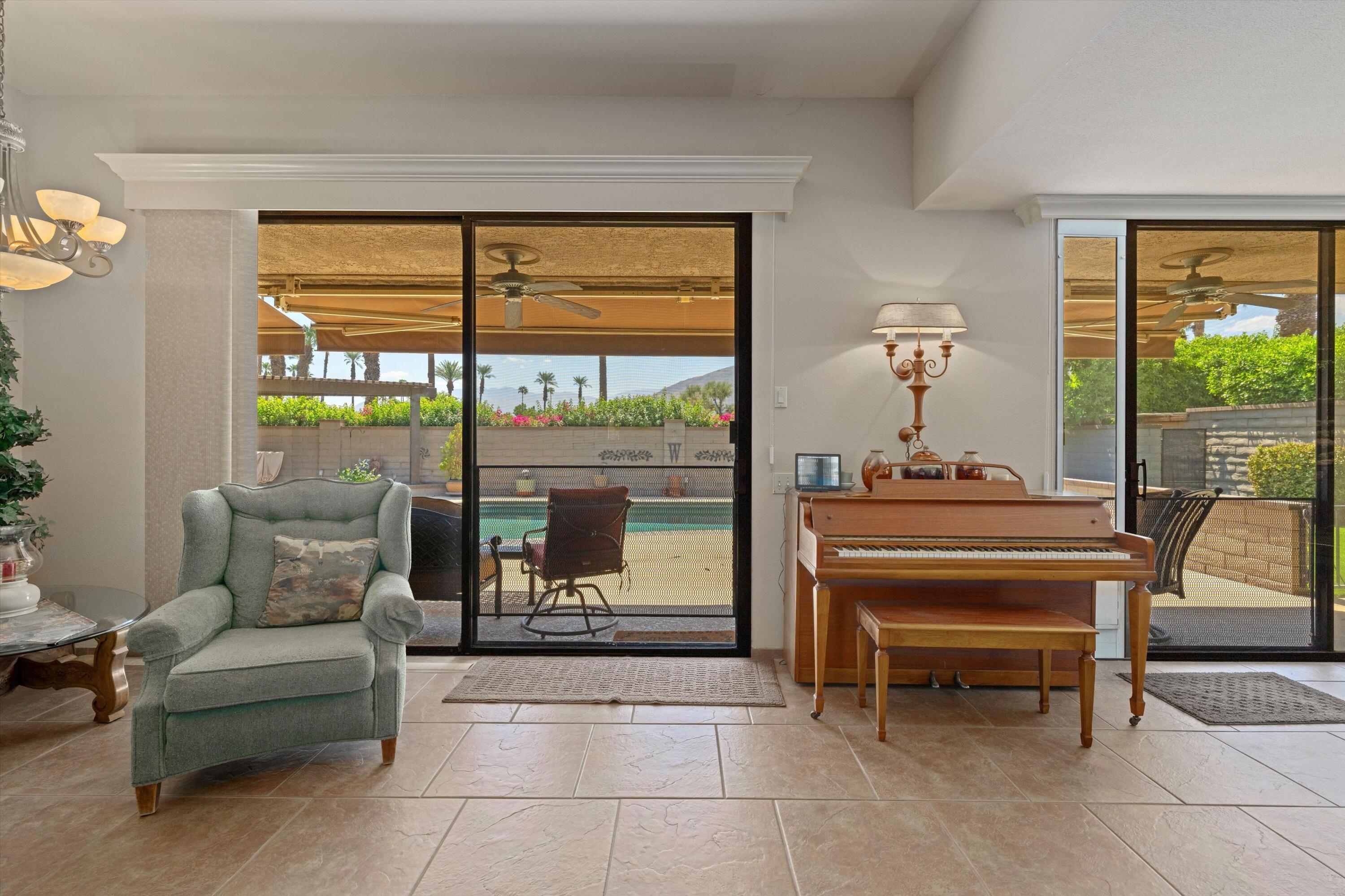 48 Cornell Drive Rancho Mirage, CA 92270 - Photo 10 of 39 a living room with furniture and a window
