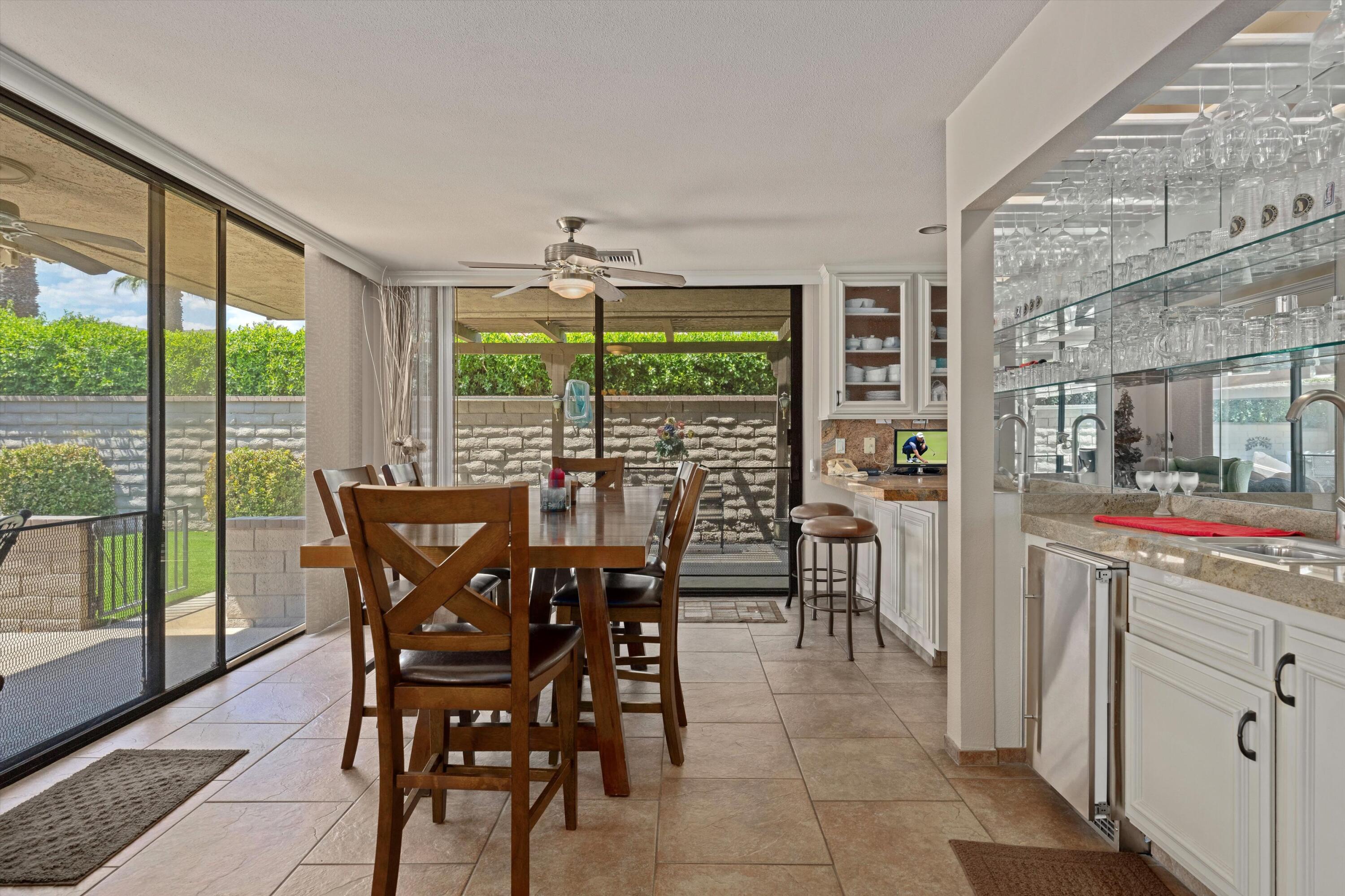 48 Cornell Drive Rancho Mirage, CA 92270 - Photo 11 of 39 a view of a dining room with furniture window and outside view