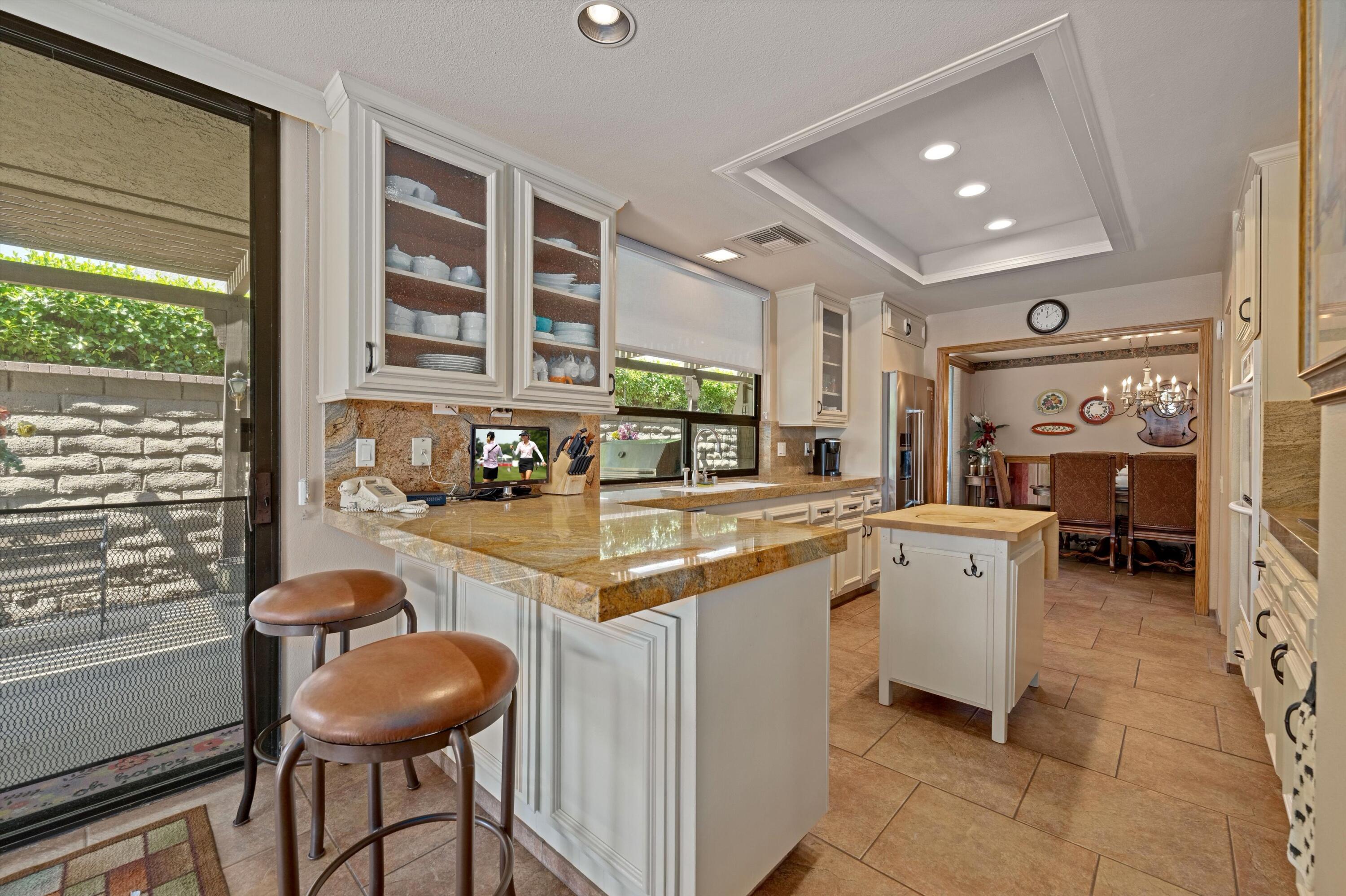 48 Cornell Drive Rancho Mirage, CA 92270 - Photo 12 of 39 a kitchen with a sink cabinets and window