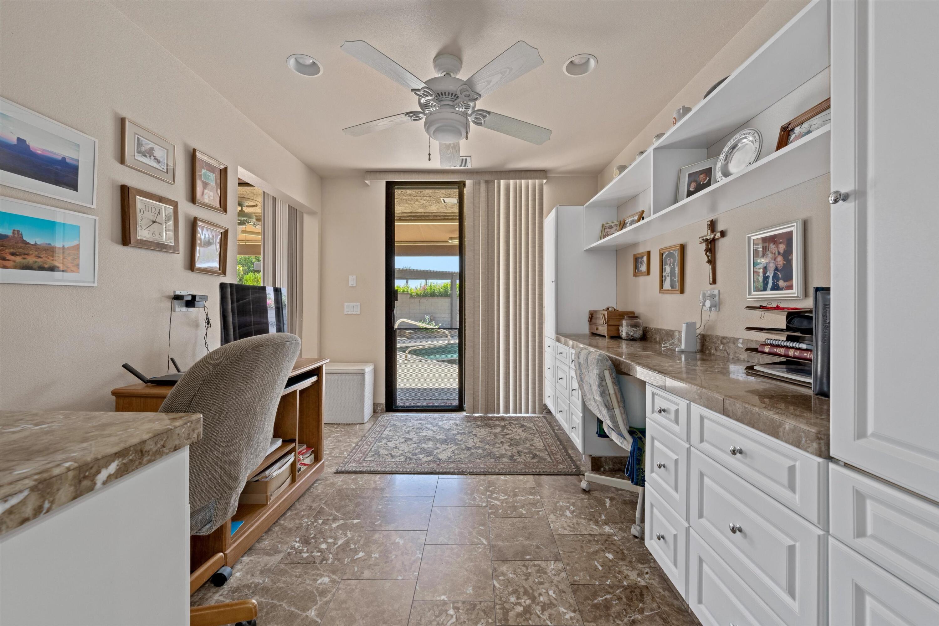 48 Cornell Drive Rancho Mirage, CA 92270 - Photo 17 of 39 a kitchen with stainless steel appliances granite countertop a sink stove and cabinets