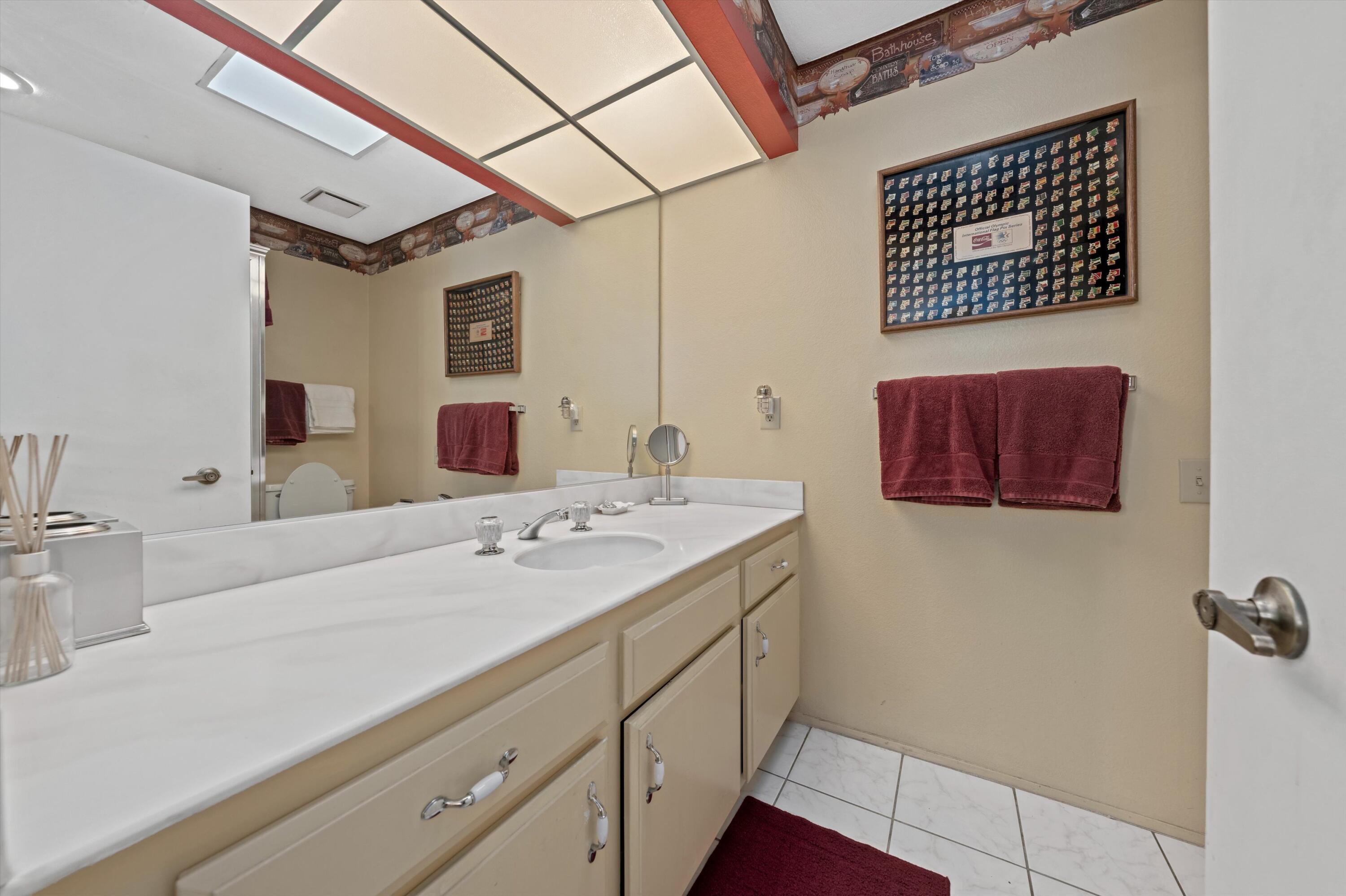 48 Cornell Drive Rancho Mirage, CA 92270 - Photo 18 of 39 a bathroom with a sink and a mirror