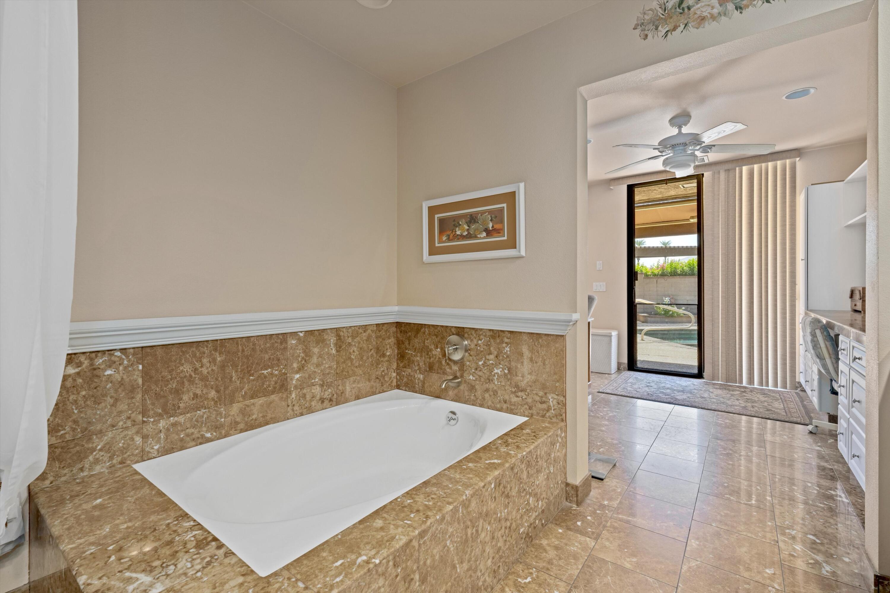 48 Cornell Drive Rancho Mirage, CA 92270 - Photo 21 of 39 an empty room with windows