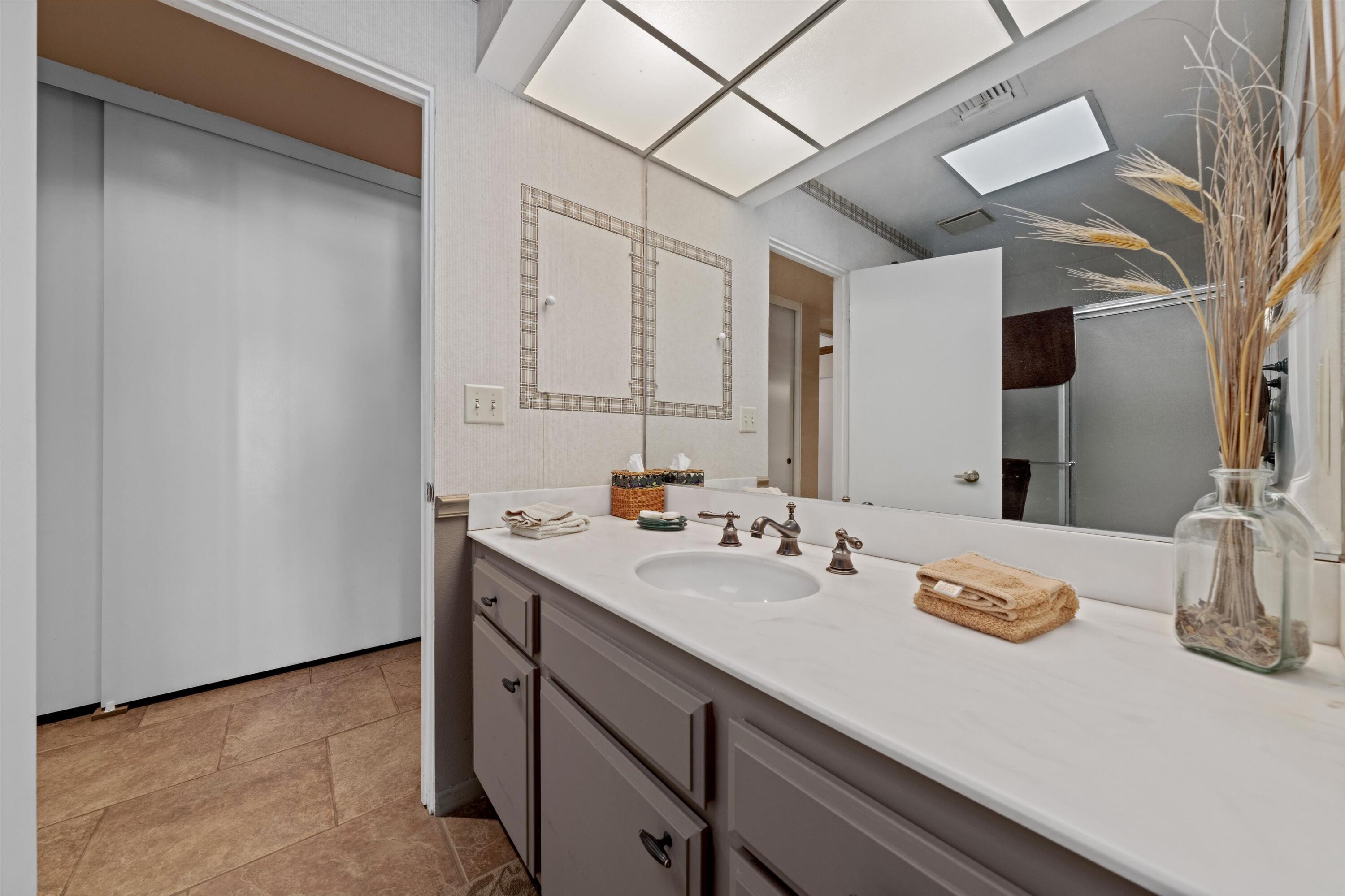 48 Cornell Drive Rancho Mirage, CA 92270 - Photo 25 of 39 a bathroom with a sink and a mirror