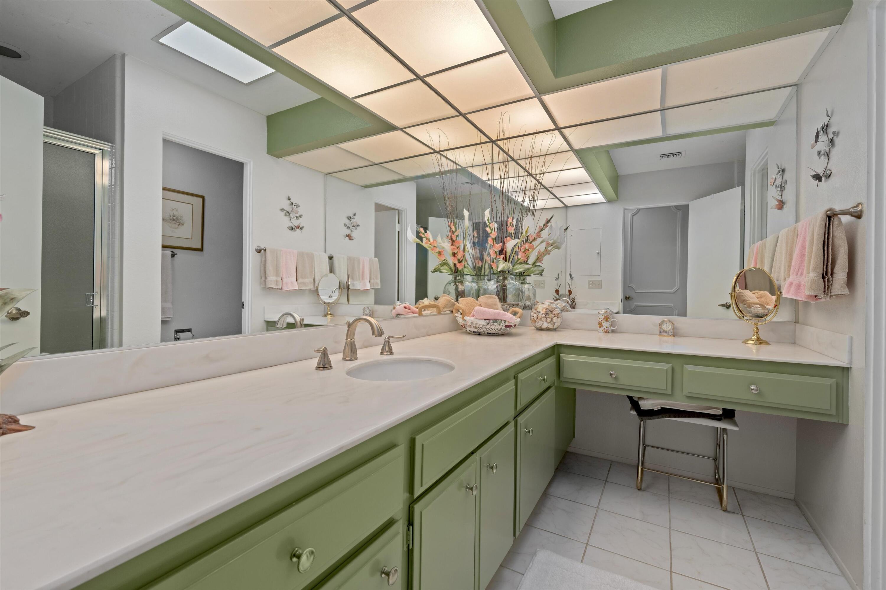 48 Cornell Drive Rancho Mirage, CA 92270 - Photo 27 of 39 a bathroom with a sink and a mirror
