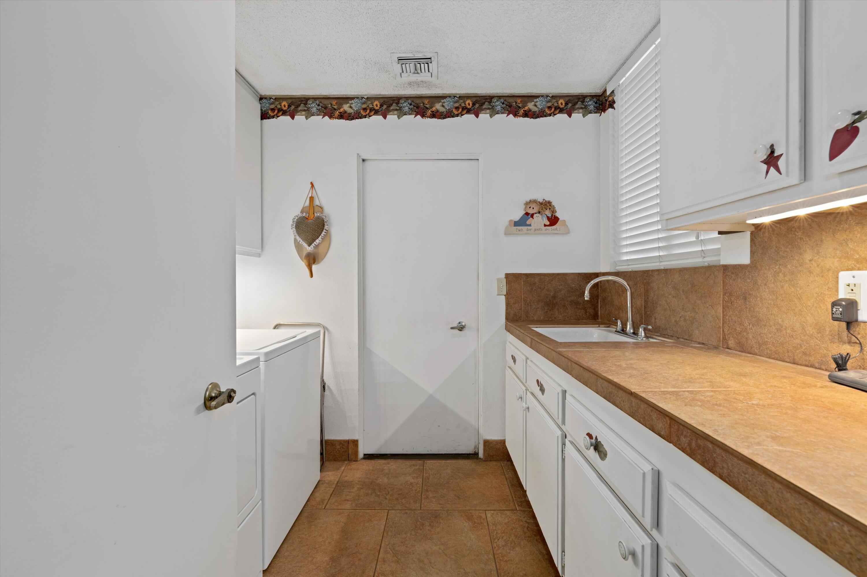 48 Cornell Drive Rancho Mirage, CA 92270 - Photo 28 of 39 a bathroom with a granite countertop sink a mirror a vanity and shower