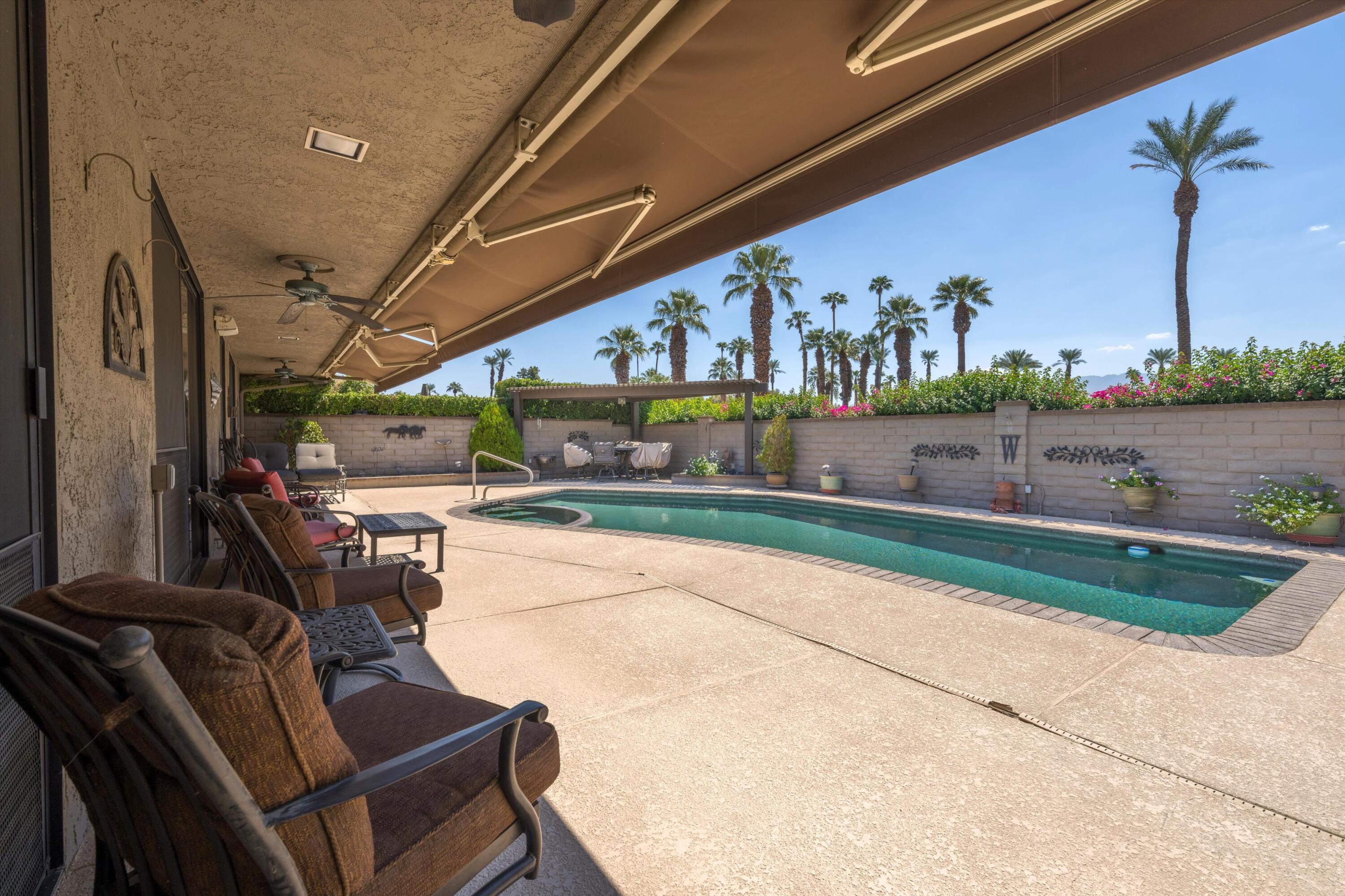 48 Cornell Drive Rancho Mirage, CA 92270 - Photo 29 of 39 a view of swimming pool with outdoor seating