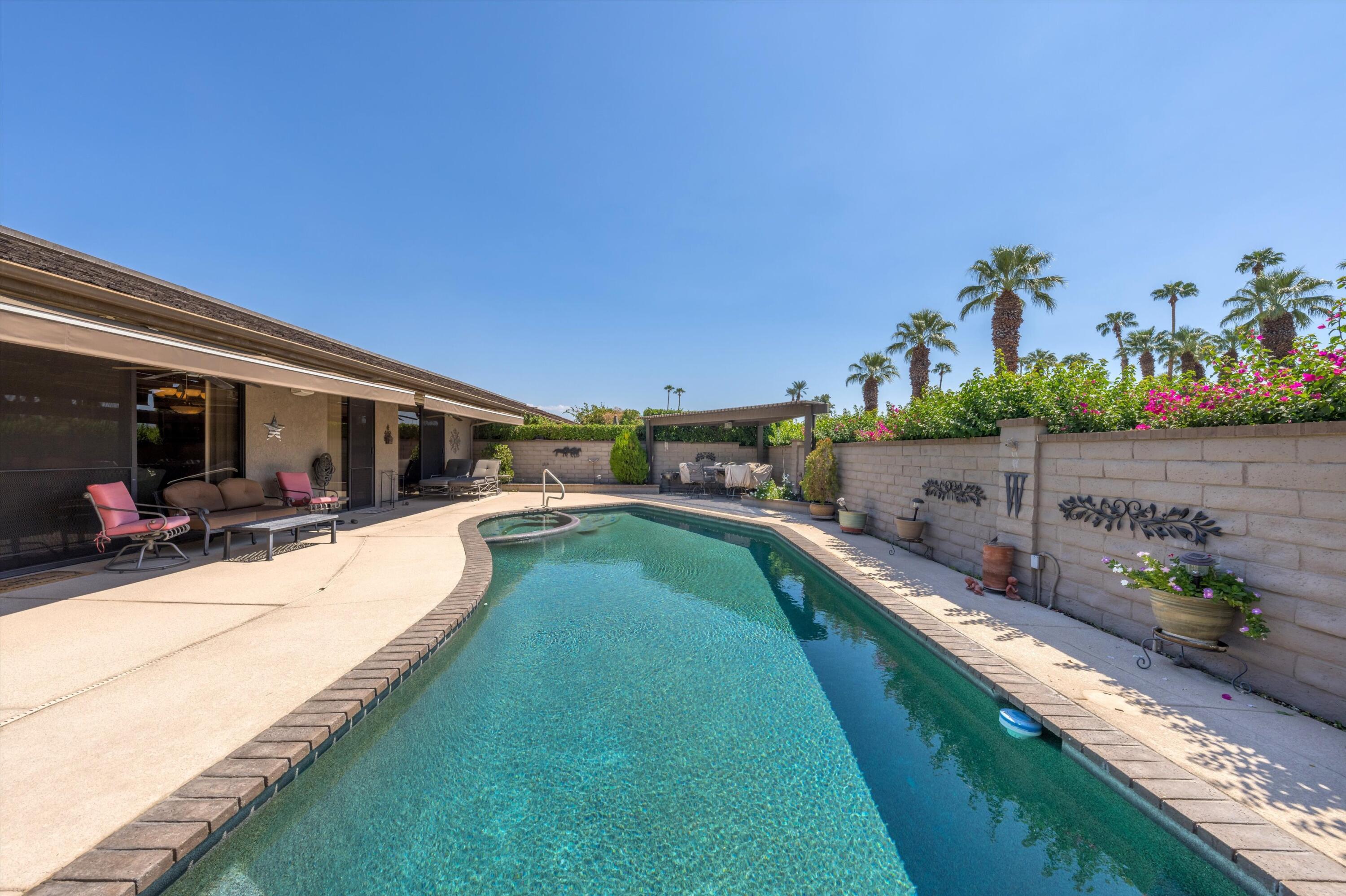 48 Cornell Drive Rancho Mirage, CA 92270 - Photo 30 of 39 a view of a house with a yard