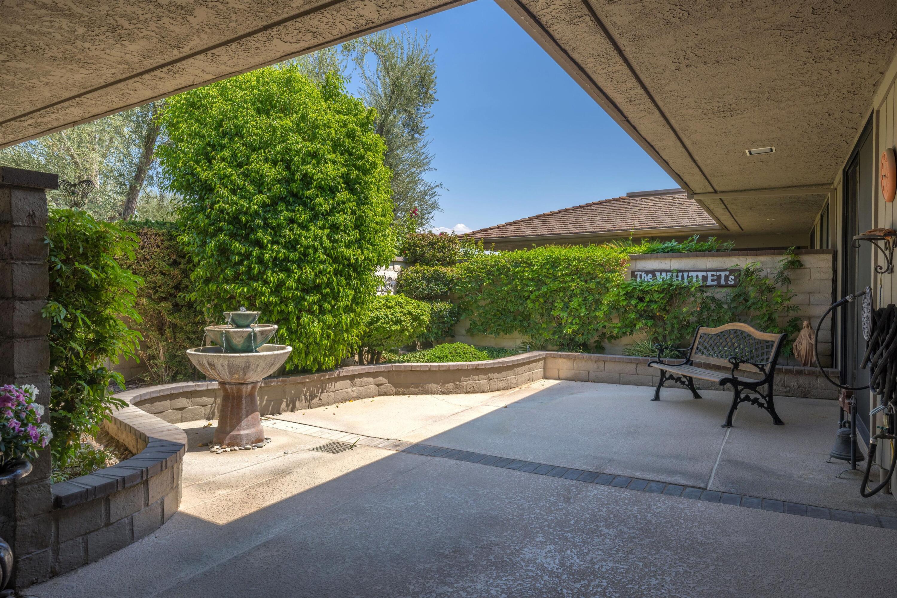 48 Cornell Drive Rancho Mirage, CA 92270 - Photo 3 of 39 a view of a patio with table and chairs potted plants with wooden floor