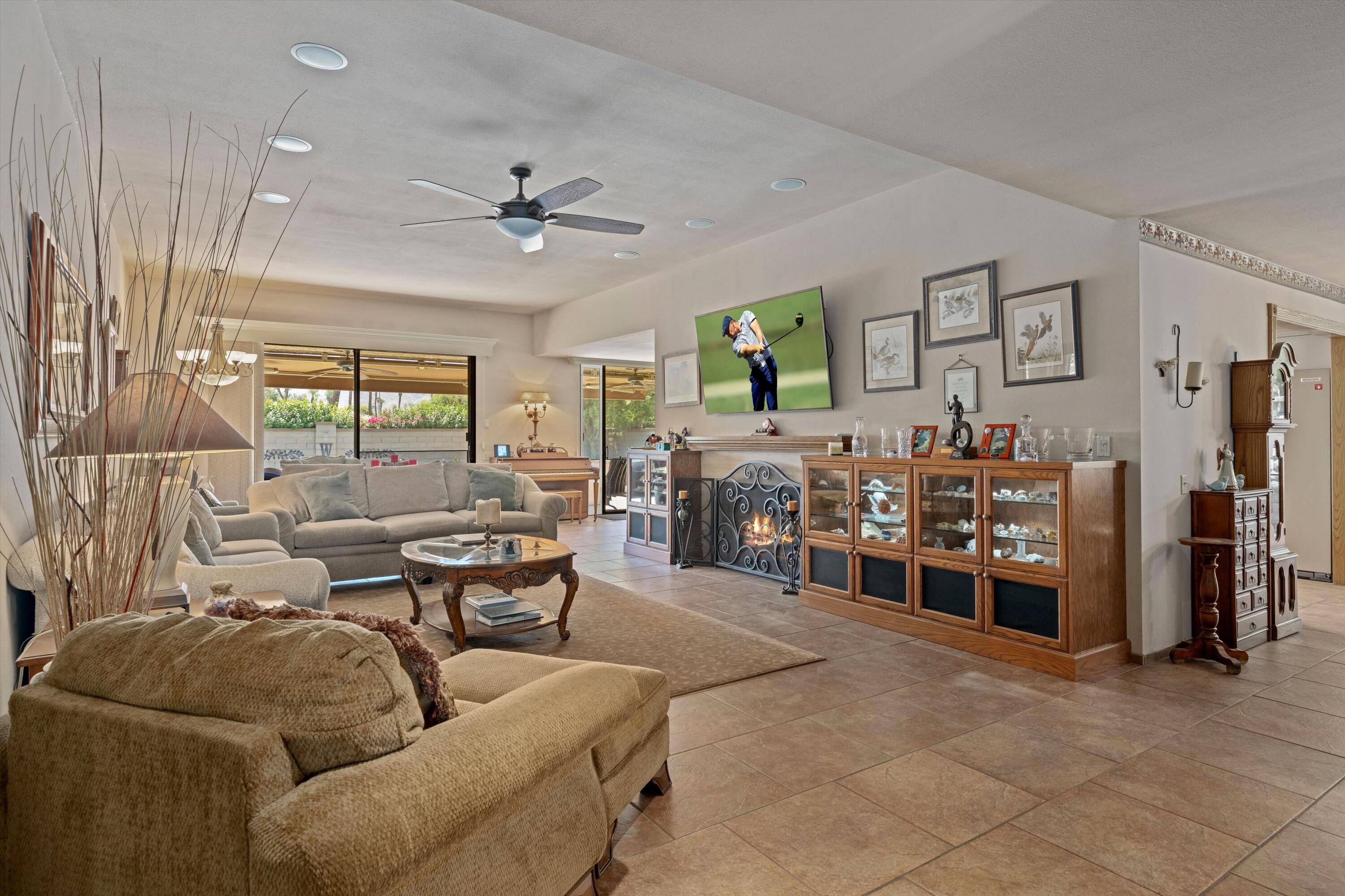 48 Cornell Drive Rancho Mirage, CA 92270 - Photo 7 of 39 a living room with furniture a ceiling fan and a window